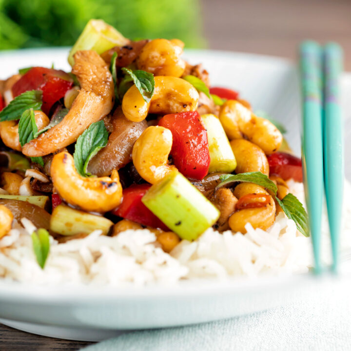 Thai cashew chicken stir fry with red peppers and thai basil served on steamed rice.