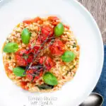 Overhead tomato risotto with basil and roasted tomatoes featuring a title overlay.