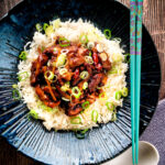 Overhead General Tso's chicken fakeaway recipe served on white rice.