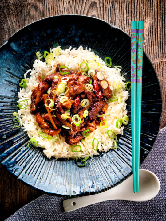 Overhead General Tso's chicken fakeaway recipe served on white rice.