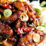 Close up General Tso's chicken fakeaway recipe served on white rice.
