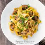 Garlic mushroom pappardelle with balsamic vinegar served in a white bowl featuring a title overlay.