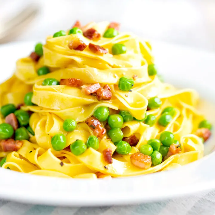 Silky pasta carbonara with peas, bacon and tagliatelle pasta.