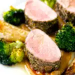 Roast pork fillet served with apple puree, roast parsnips and broccoli.
