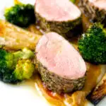 Roast pork fillet served with apple puree, roast parsnips and broccoli featuring a title overlay.