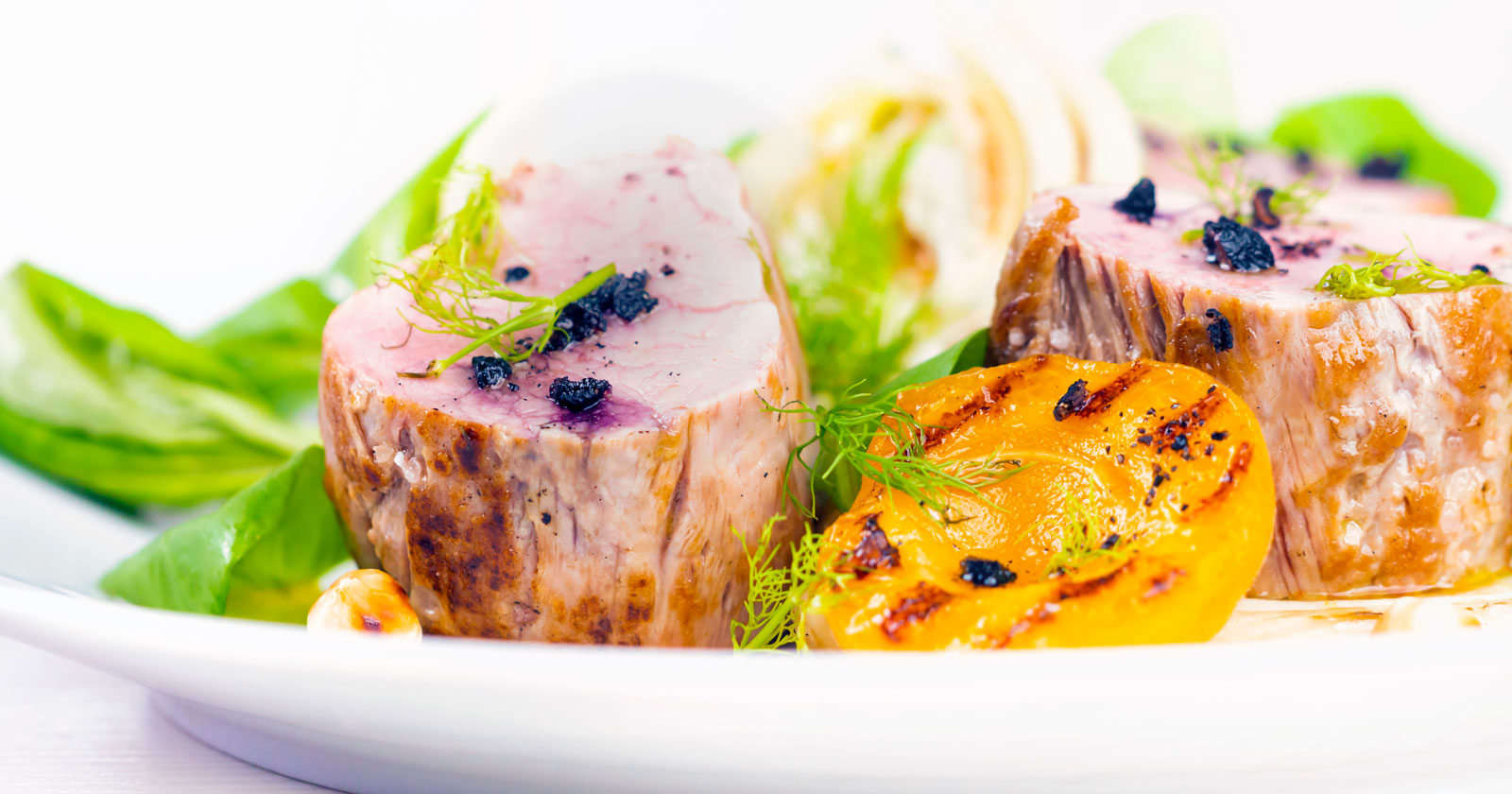 Roast pork tenderloin with apricot, fennel and Tasmanian pepperberry.