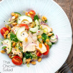 Overhead crunchy & spicy Thai chicken salad with peanuts featuring a title overlay.