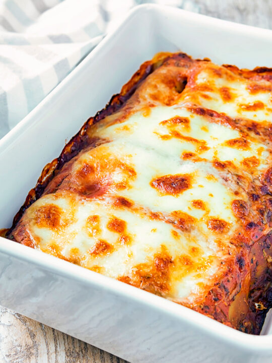 Goats cheese cannelloni with spinach served in a baking dish.