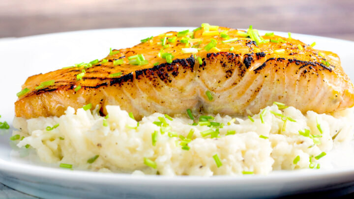 Pan fried honey mustard salmon served on celeriac mash with snipped chives.