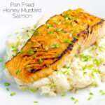 Pan fried honey mustard salmon served on celeriac mash featuring a title overlay.