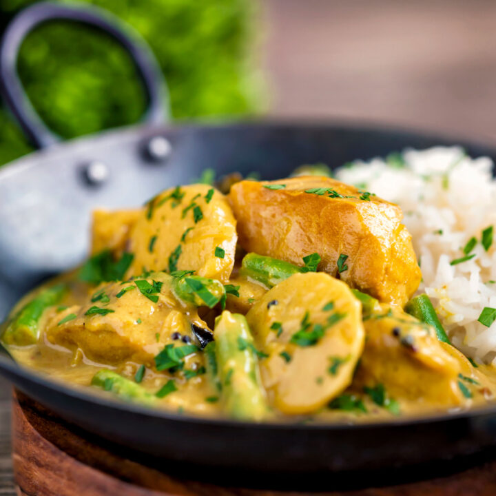 Keralan fish curry with coconut milk featuring green beans and potato and basmati rice.