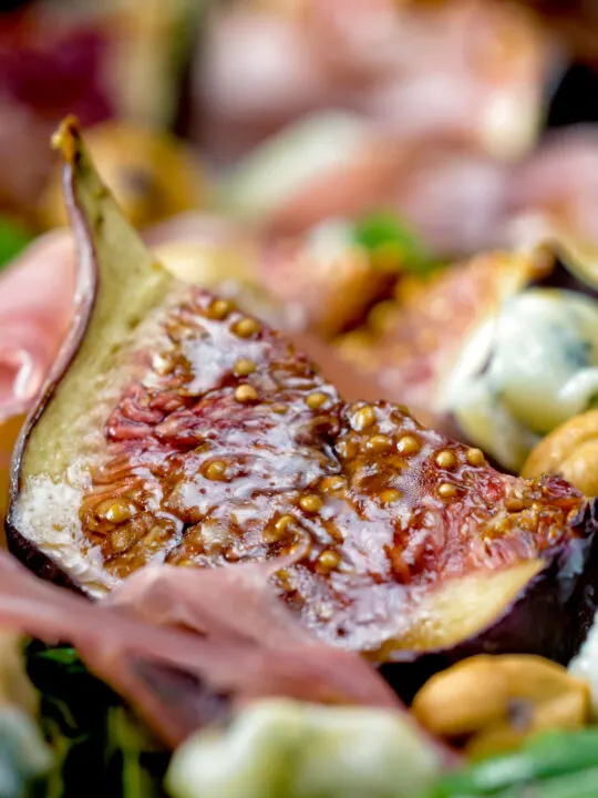 Close up roasted figs served in a salad.