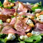 Roasted figs with prosciutto ham, rocket, blue cheese and hazelnuts.