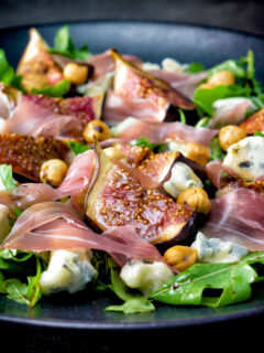 Roasted figs with prosciutto ham, rocket, blue cheese and hazelnuts.