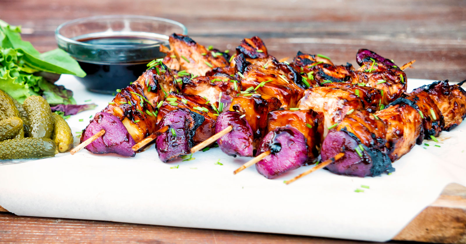 BBQ chicken skewers with pineapple & red onion with a sweet & sour glaze.