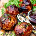 Stuffed onions wrapped in bacon & BBQ sauce glaze.