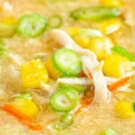 Close up Chinese style chicken and sweetcorn soup with spring onion.