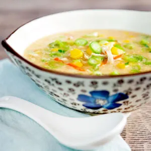 Chinese style chicken and sweetcorn soup served in a stylised flower decorated bowl.