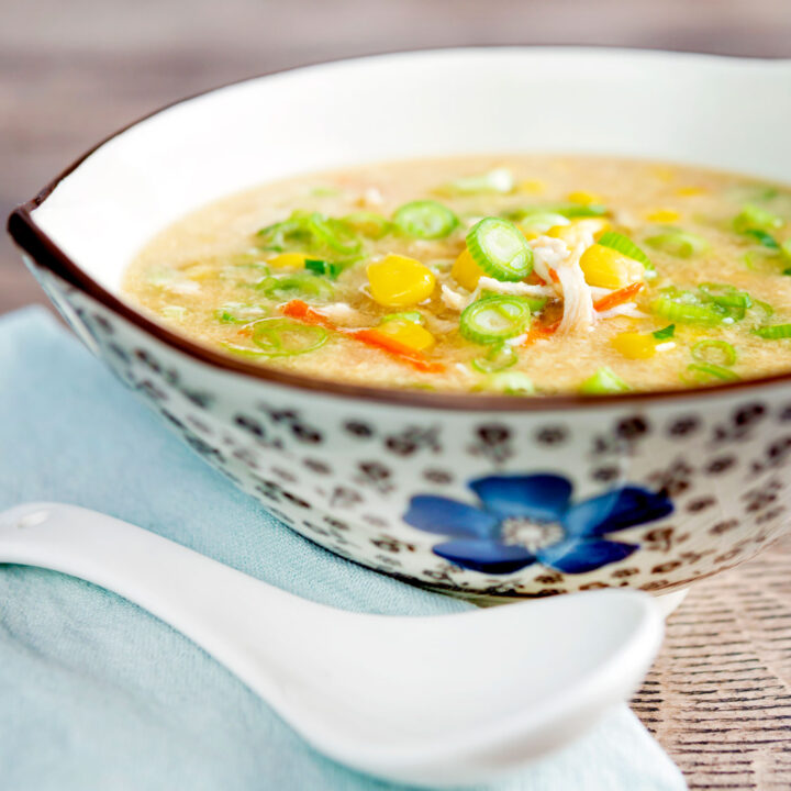 Chinese style chicken and sweetcorn soup served in a stylised flower decorated bowl.