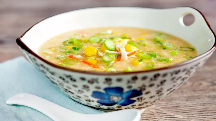 Chinese style chicken and sweetcorn soup served in a stylised flower decorated bowl.