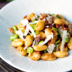 Pan fried gnocchi with bacon, broad beans and parmesan shavings.