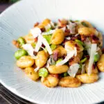 Pan fried gnocchi with bacon, broad beans and parmesan shavings.