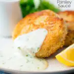 White parsley sauce served with a smoked haddock fishcake with a title overlay.
