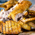 Roast duck breast from a whole roast duck with duck fat potatoes.