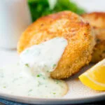 Smoked haddock fishcakes served with with parsley sauce.
