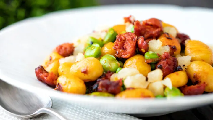 Chorizo gnocchi with broad beans, peas and manchego cheese.