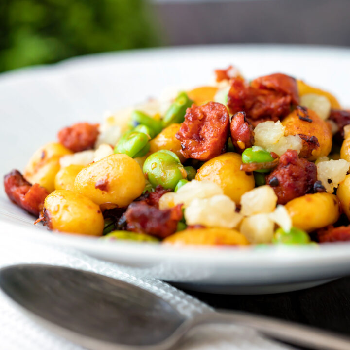 Chorizo gnocchi with broad beans, peas and manchego cheese.