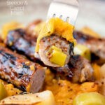 Close up sausage on a for with mustard and swede and carrot mash featuring a title overlay.