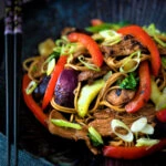 Hoisin pork stir fry with red peppers, onions and pak choi.
