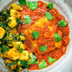 Overhead macher jhol or Bengali fish curry served with aloo methi featuring a title overlay.