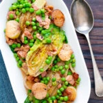 Overhead petit pois a la Francaise or French braised peas and lettuce with bacon and onions.