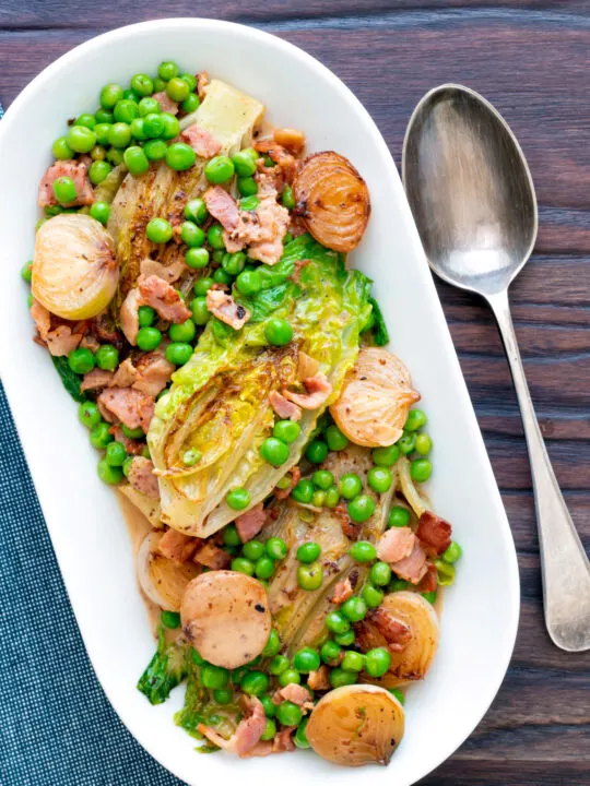 Overhead petit pois a la Francaise or French braised peas and lettuce with bacon and onions.