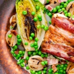 Petit pois a la Francaise or French braised peas and lettuce with bacon and pearl onions.