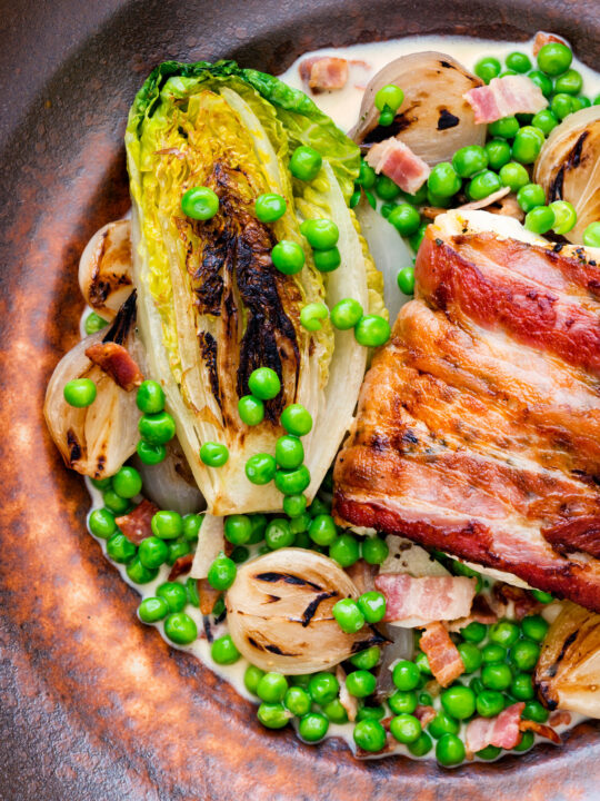 Petit pois a la Francaise or French braised peas and lettuce with bacon and pearl onions.