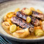 Sausage and apple casserole with leeks and a mustard and cider sauce..