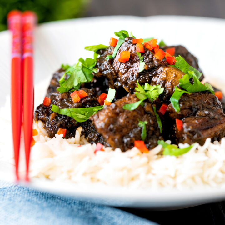 Babi chin, Indonesian soy sauce braised pork belly served with rice, coriander and chilli.