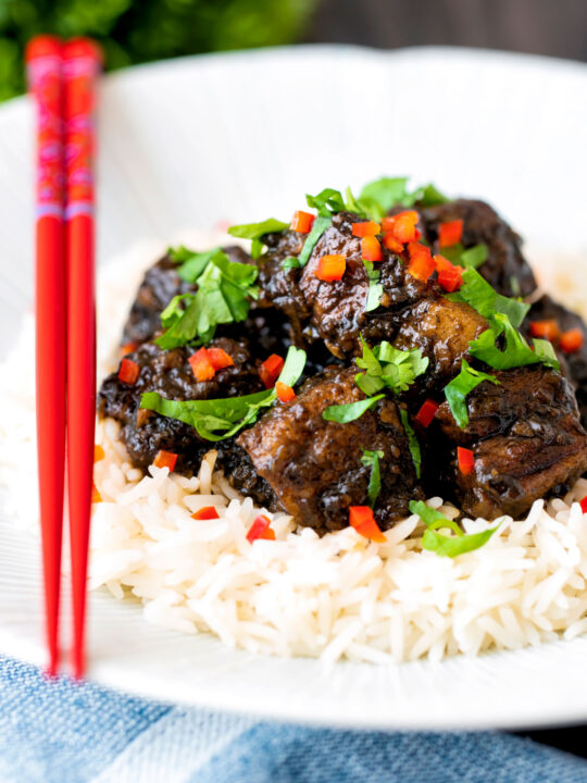 Babi chin Indonesian soy sauce braised pork belly served with coriander and chilli.