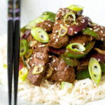 Black pepper beef stir fry with green pepper and red onion.