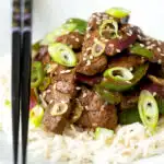 Black pepper beef stir fry with green pepper and red onion.