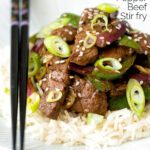 Black pepper beef stir fry with green pepper and red onion featuring a title overlay.