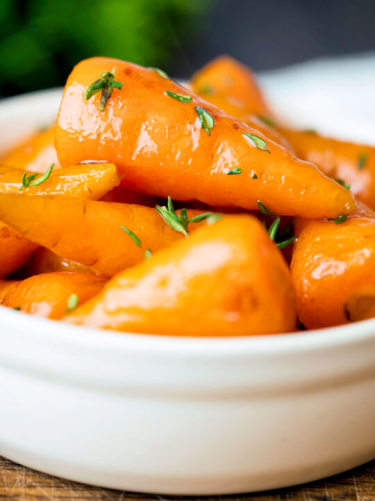 Brown sugar and butter glazed Chantenay carrots with fresh thyme.