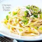 Chicken and leek pasta with linguini in a mustard and creme fraiche sauce featuring a title overlay.