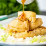 Lemon sauce poured over Chinese crispy lemon chicken.