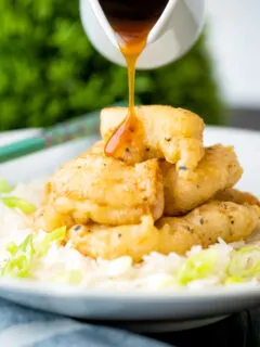 Lemon sauce poured over Chinese crispy lemon chicken.