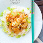 Over head Chinese crispy lemon chicken served with rice featuring a title overlay.