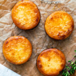 Overhead fondant potatoes poached in butter and stock with a sprig of thyme featuring a title overlay.